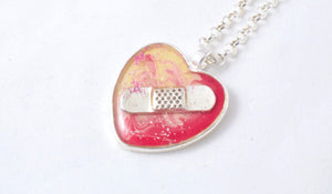 Pink and Yellow Bandaid Necklace - Jenny Bagwill Art